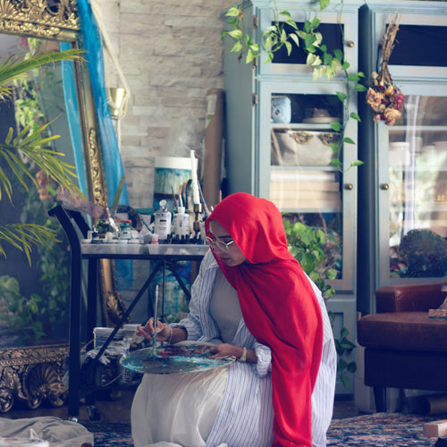 Saleha Contractor painting in her Toronto studio