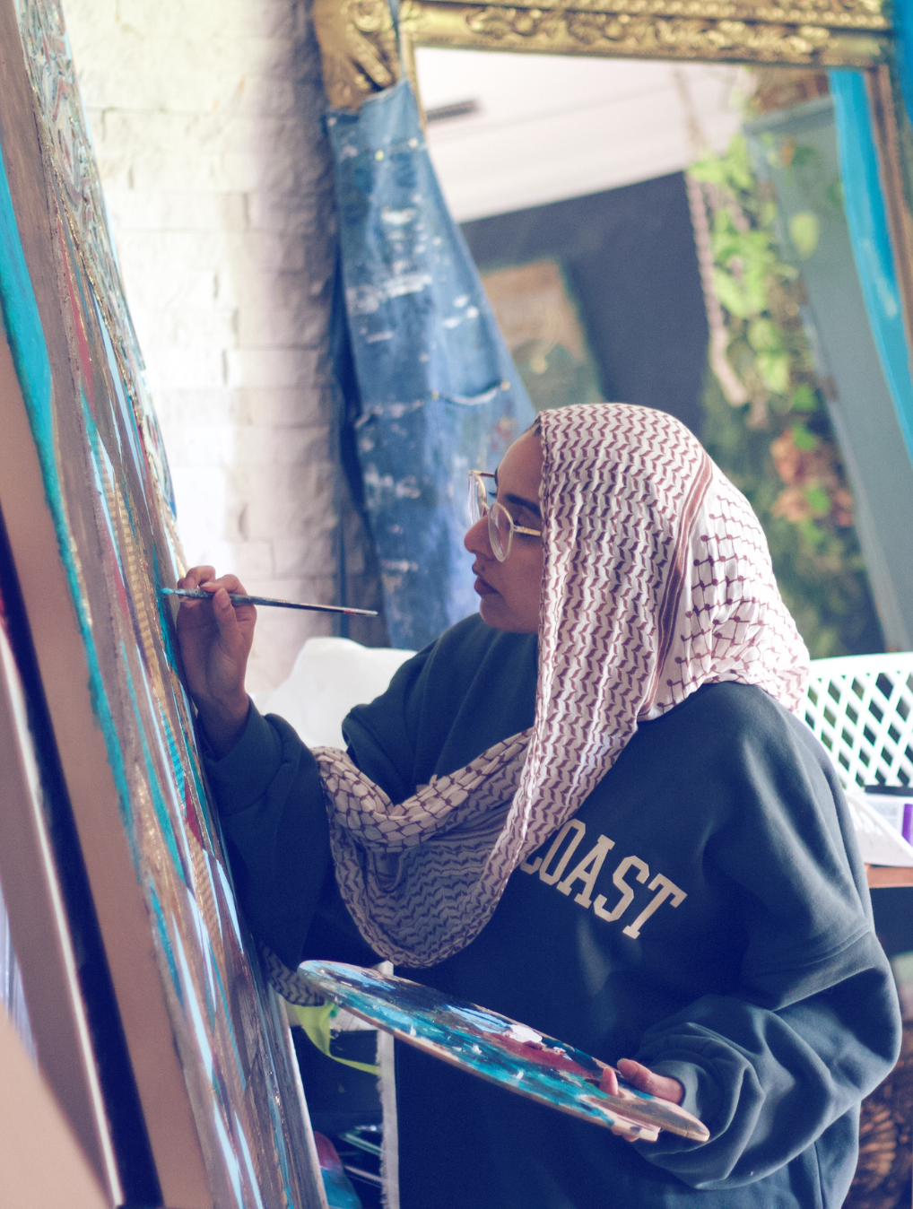 Saleha Contractor painting in her studio