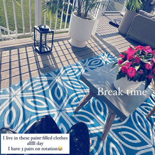 Saleha Contractor taking a break from painting