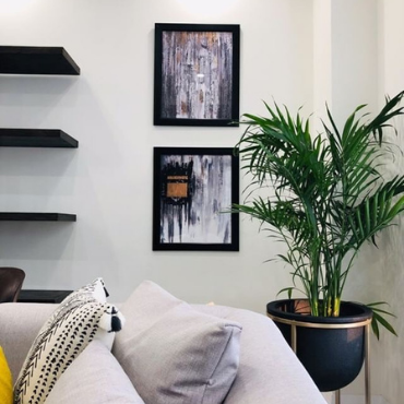 Gallery wall of Saleha Art prints in a client's home