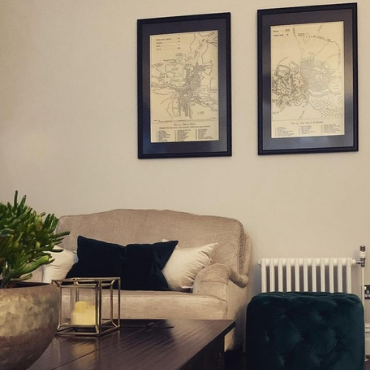Gallery wall of Saleha Art prints in a client's home