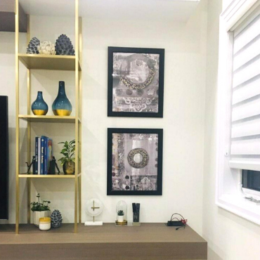 Gallery wall of Saleha Art prints in a client's home