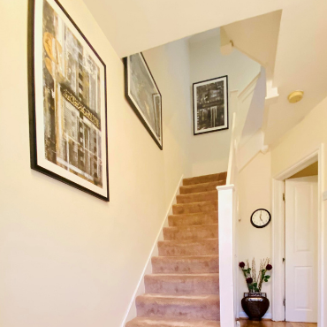 Gallery wall of Saleha Art prints in a client's home