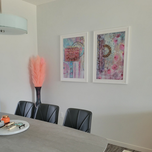 Gallery wall of Saleha Art prints in a client's home