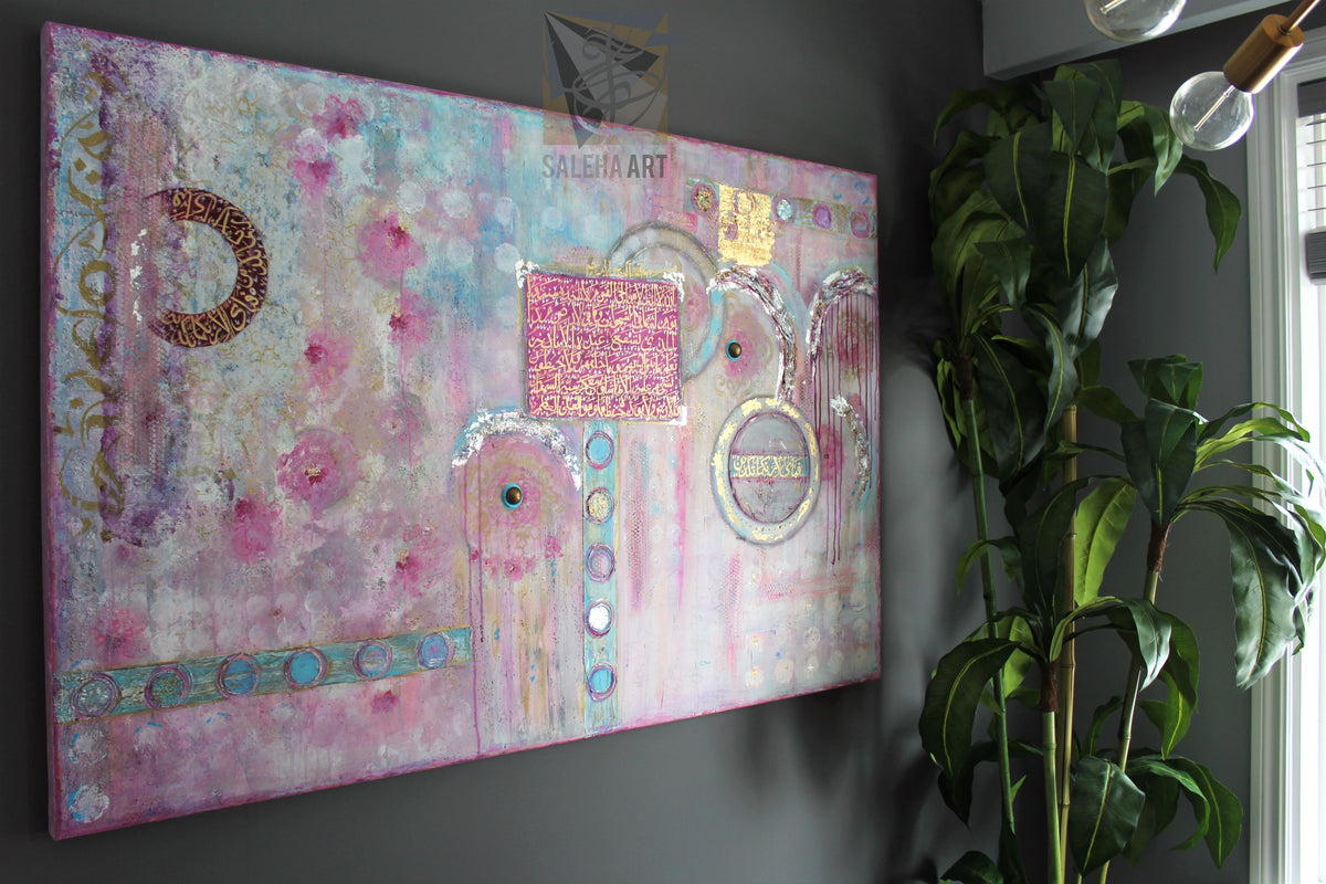 Queens of Jannah original Islamic painting by Saleha: pink, turquoise and gold canvas with Ayatul Kursi calligraphy on a dark wall